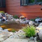 Gallery image showing a flowing natural pond with greenery